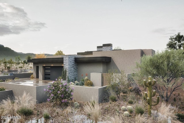 view of side of home featuring a garage