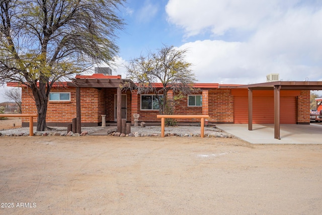 rear view of property with central air condition unit