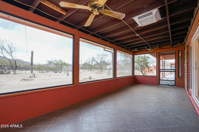unfurnished sunroom with visible vents and a ceiling fan