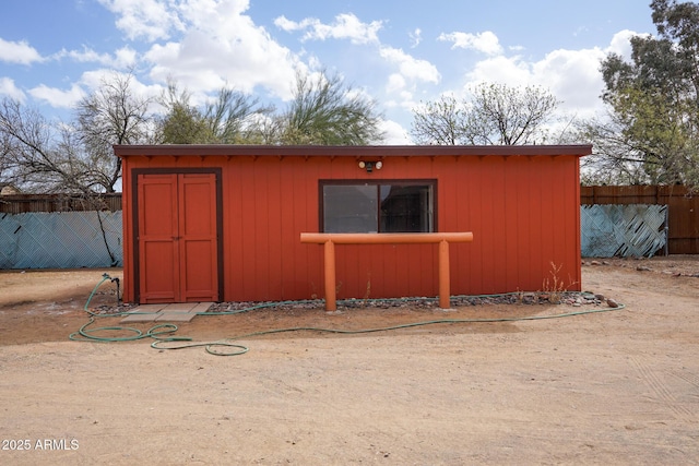 view of outdoor structure with an outdoor structure and fence