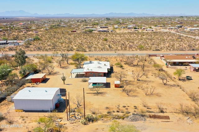 bird's eye view with a mountain view and a desert view