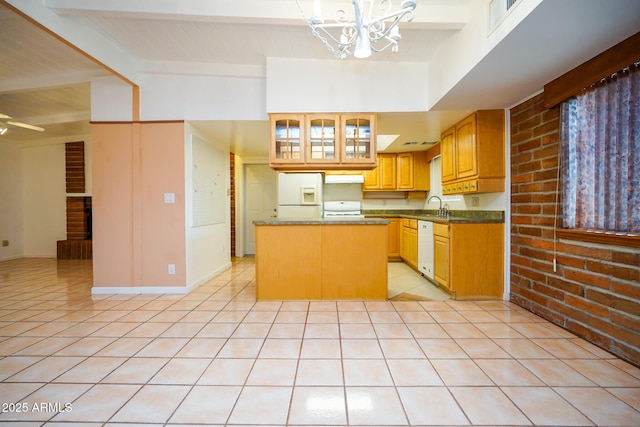 kitchen with beamed ceiling, a sink, a center island, white appliances, and light tile patterned floors