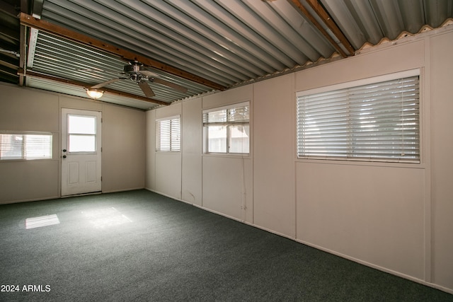 unfurnished room with carpet flooring, a wealth of natural light, and ceiling fan