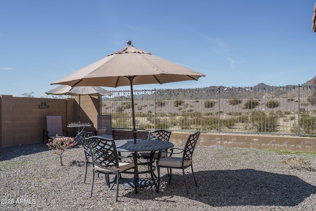 view of patio / terrace featuring fence