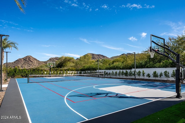 view of basketball court with a mountain view