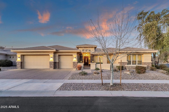 prairie-style home featuring a garage