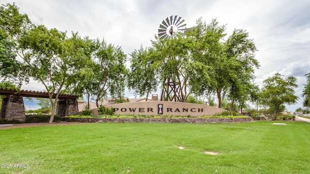 community / neighborhood sign with a lawn