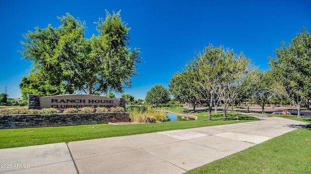 view of community featuring a yard and a water view