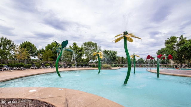 view of pool with pool water feature