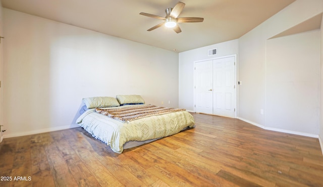 bedroom with wood-type flooring and ceiling fan