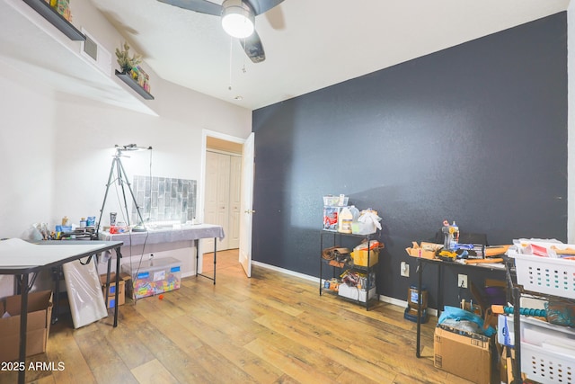 miscellaneous room featuring hardwood / wood-style flooring and ceiling fan