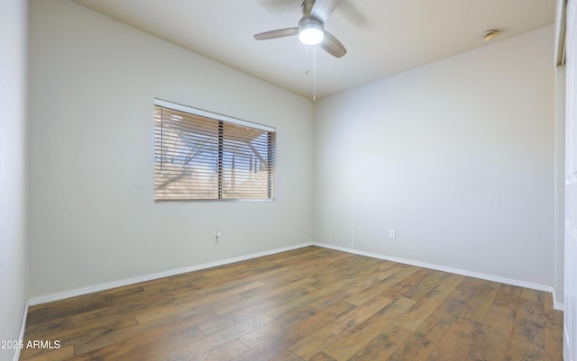 unfurnished room with dark hardwood / wood-style flooring and ceiling fan