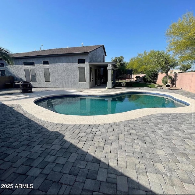 view of pool with fence, a patio area, and a fenced in pool