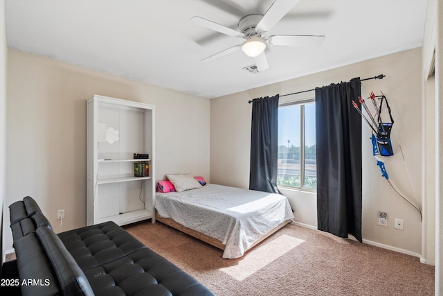 carpeted bedroom featuring baseboards, visible vents, and a ceiling fan