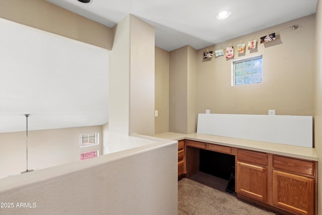 unfurnished office featuring built in study area, light colored carpet, and recessed lighting
