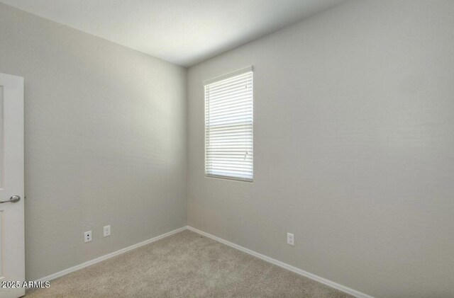 14870 W Encanto Blvd Unit 1106, Goodyear, AZ 85395 - unfurnished room featuring carpet floors and baseboards