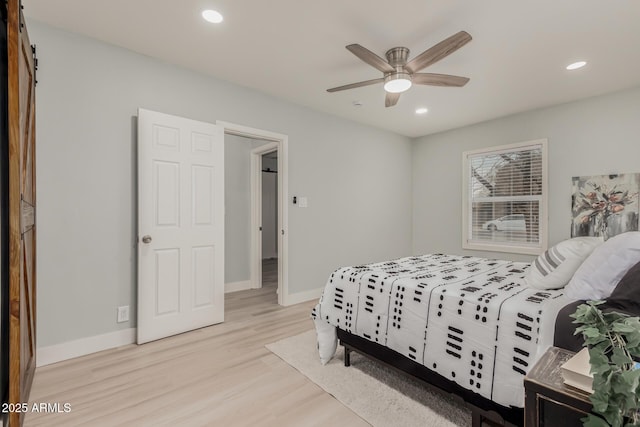 bedroom featuring light hardwood / wood-style flooring and ceiling fan