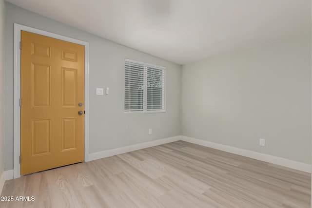 unfurnished room with light hardwood / wood-style floors