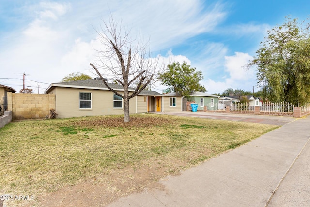 ranch-style house with a front yard