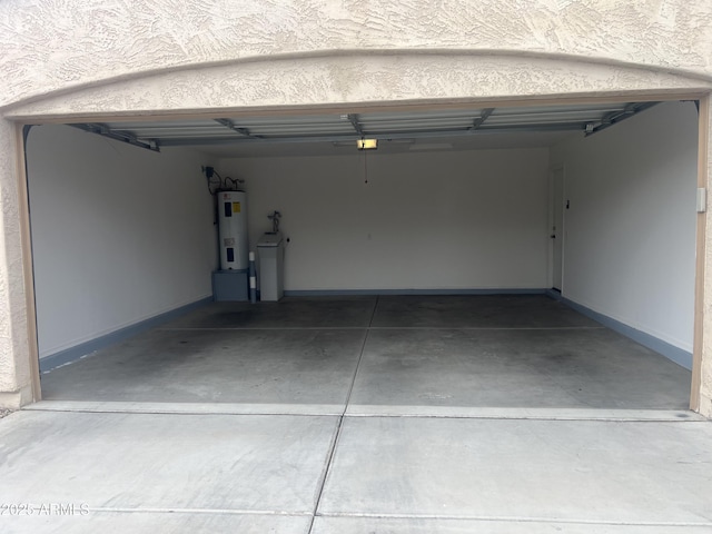 garage with water heater and a garage door opener
