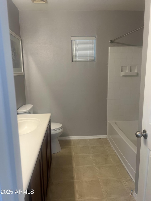 bathroom featuring toilet, visible vents, baseboards, tile patterned flooring, and vanity