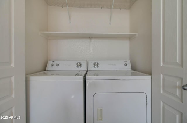 laundry room with washing machine and clothes dryer and laundry area