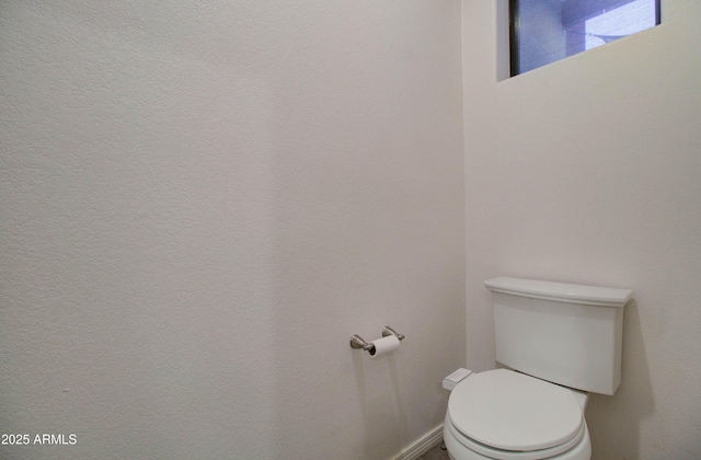 bathroom featuring toilet
