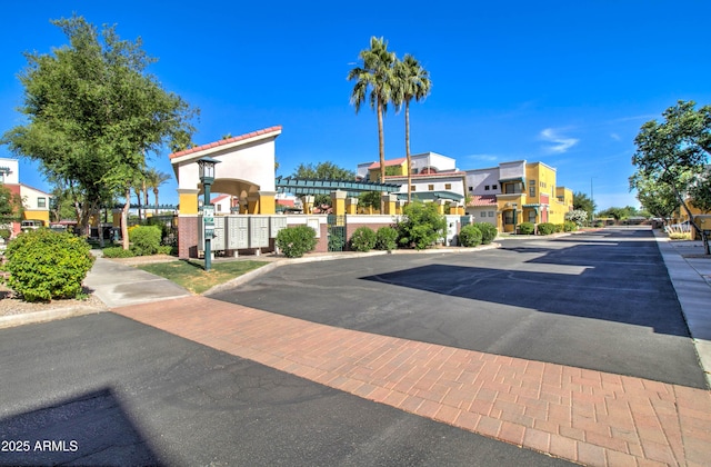 view of street featuring sidewalks, curbs, and street lights