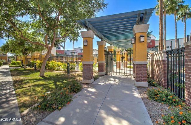 view of property's community with a gate and fence