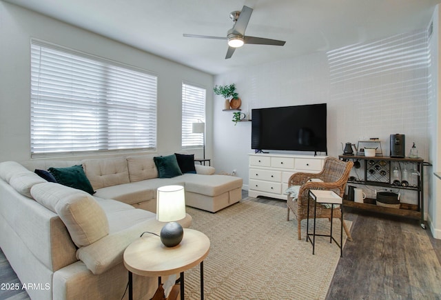living area with ceiling fan and wood finished floors