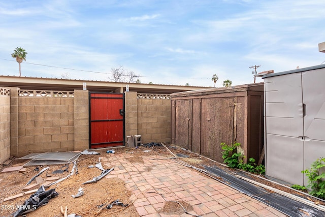 view of patio / terrace with fence and a gate