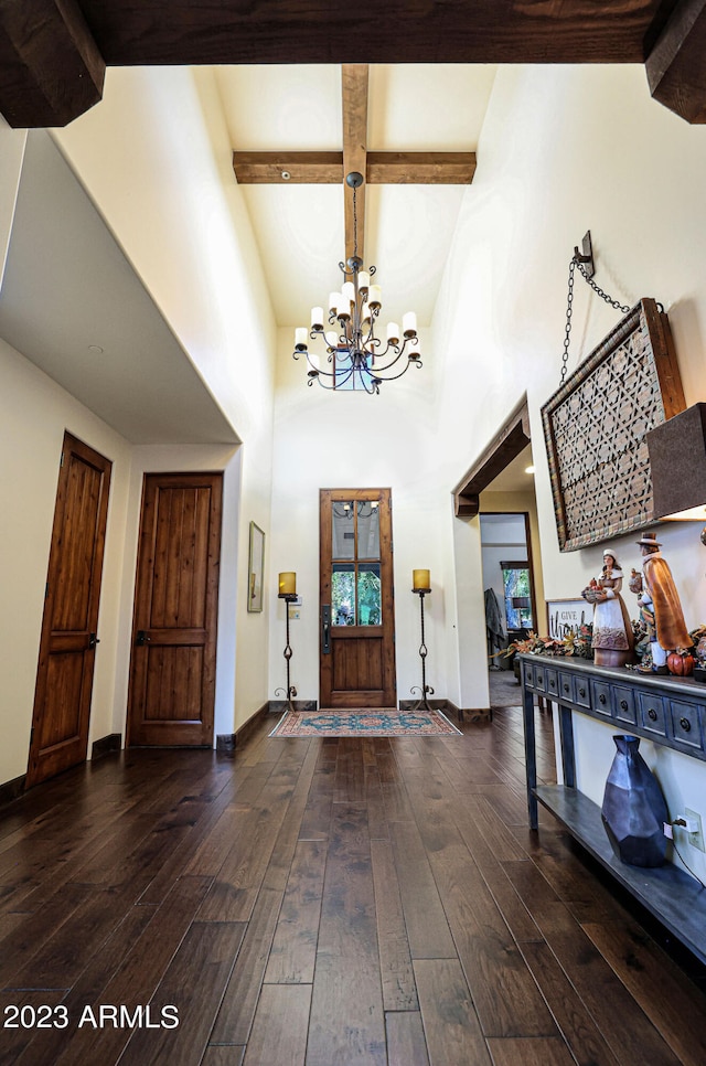 foyer with high vaulted ceiling, a chandelier, beamed ceiling, and dark hardwood / wood-style floors