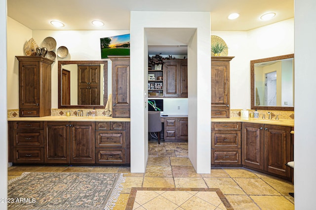 bathroom featuring backsplash and vanity