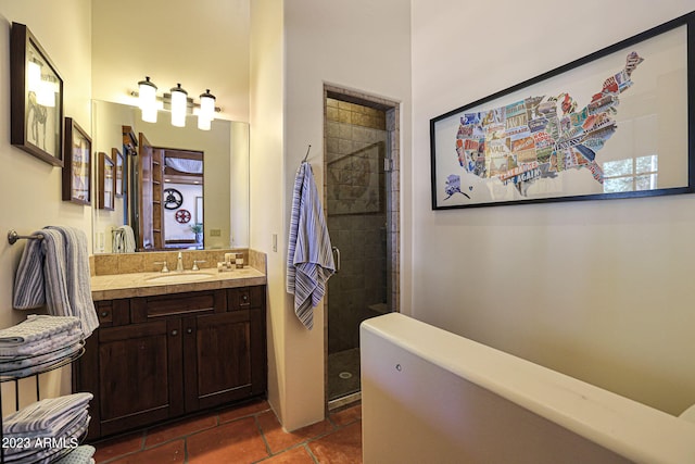 bathroom featuring vanity and tiled shower