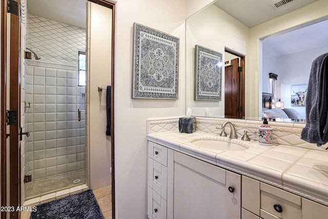 bathroom featuring vanity and an enclosed shower