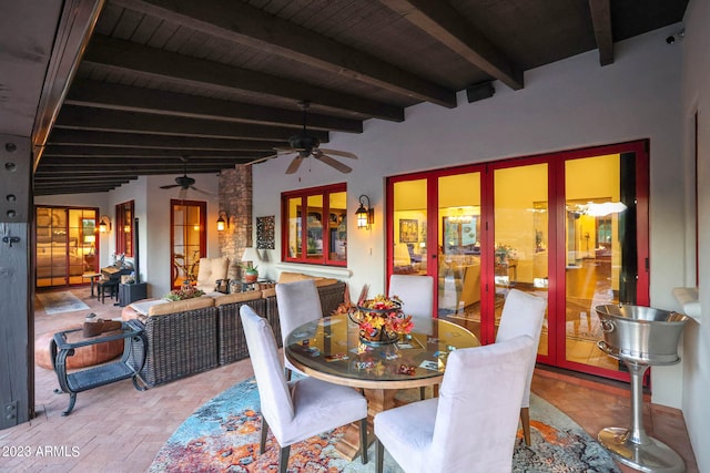 dining space with wood ceiling, ceiling fan, beamed ceiling, and french doors