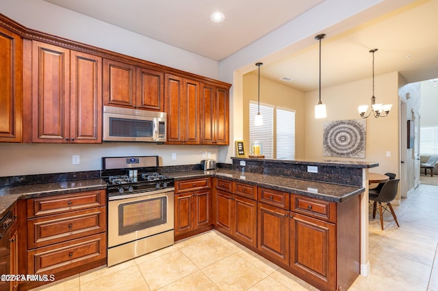 kitchen with kitchen peninsula, stainless steel appliances, hanging light fixtures, and a notable chandelier