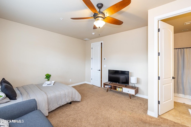 bedroom with light colored carpet and ceiling fan