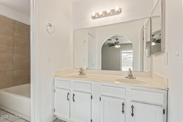 4845 W Evans Dr, Glendale, AZ 85306 - full bathroom featuring ceiling fan, double vanity, and washtub / shower combination