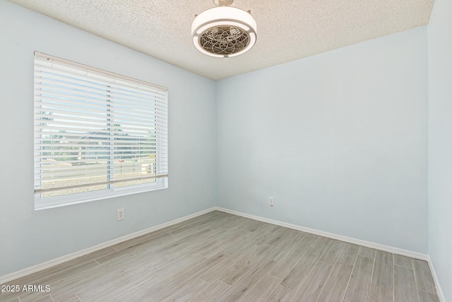 4845 W Evans Dr, Glendale, AZ 85306 - unfurnished room featuring wood finished floors and a textured ceiling