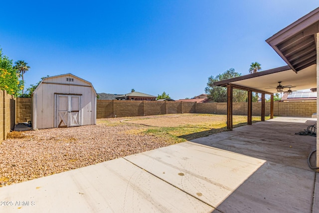 4845 W Evans Dr, Glendale, AZ 85306 - fenced backyard with a patio, ceiling fan, and a shed