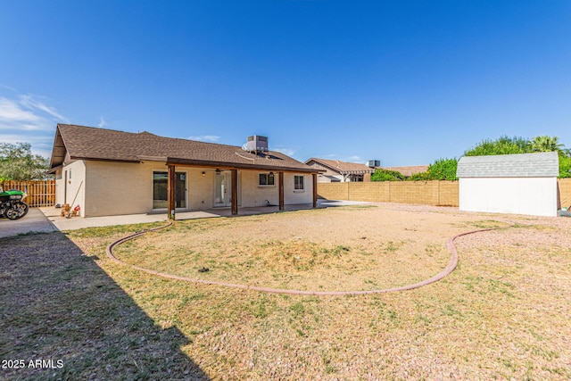 4845 W Evans Dr, Glendale, AZ 85306 - back of house with a storage unit, a patio area, a fenced backyard, and brick siding