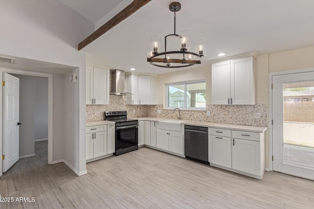 4845 W Evans Dr, Glendale, AZ 85306 - kitchen with range with electric cooktop, wall chimney exhaust hood, dishwasher, a chandelier, and light countertops