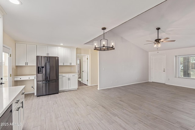 4845 W Evans Dr, Glendale, AZ 85306 - kitchen featuring stainless steel refrigerator with ice dispenser, light countertops, a chandelier, white cabinets, and recessed lighting