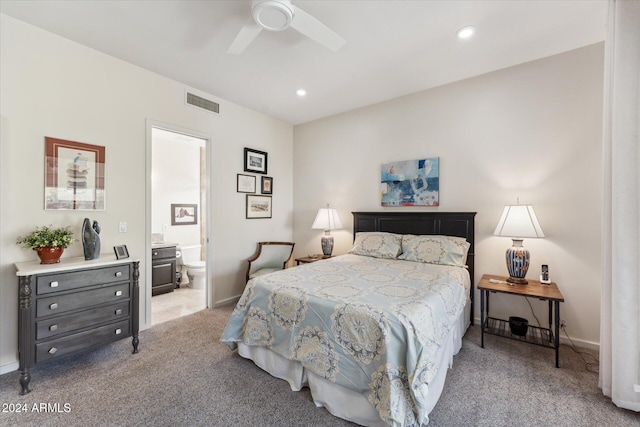 carpeted bedroom with ceiling fan and ensuite bathroom