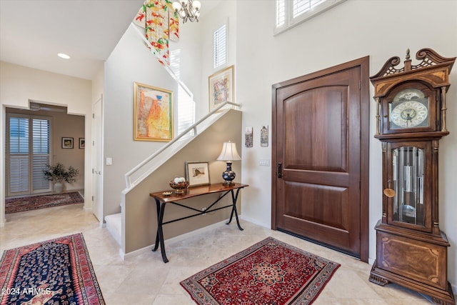 entrance foyer featuring a notable chandelier