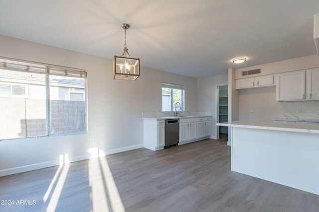 kitchen featuring pendant lighting, wood-type flooring, white cabinetry, and stainless steel dishwasher