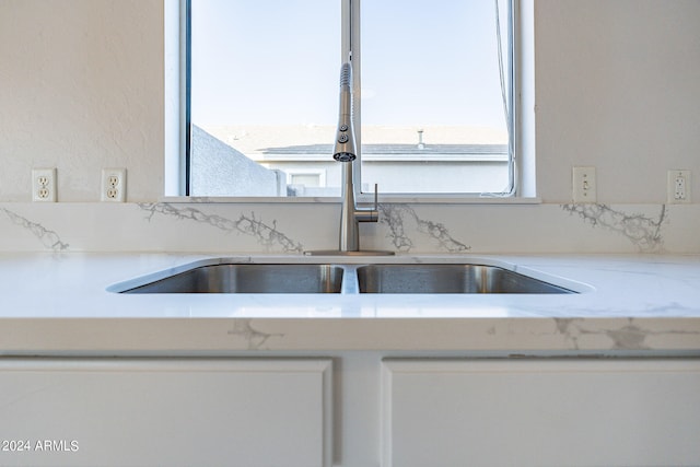 kitchen with white cabinets and plenty of natural light