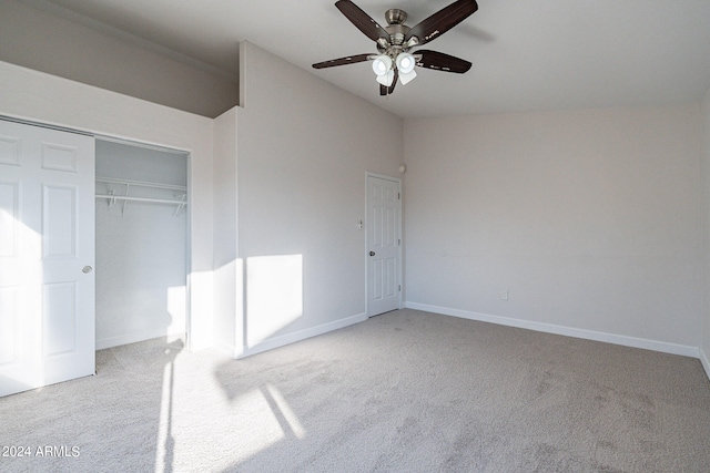 unfurnished bedroom with ceiling fan, a closet, and light carpet