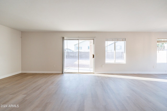 unfurnished room featuring light hardwood / wood-style floors